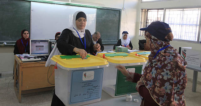 A woman casts a ballot as local polls begin across the Kingdom on Tuesday (Petra photo)